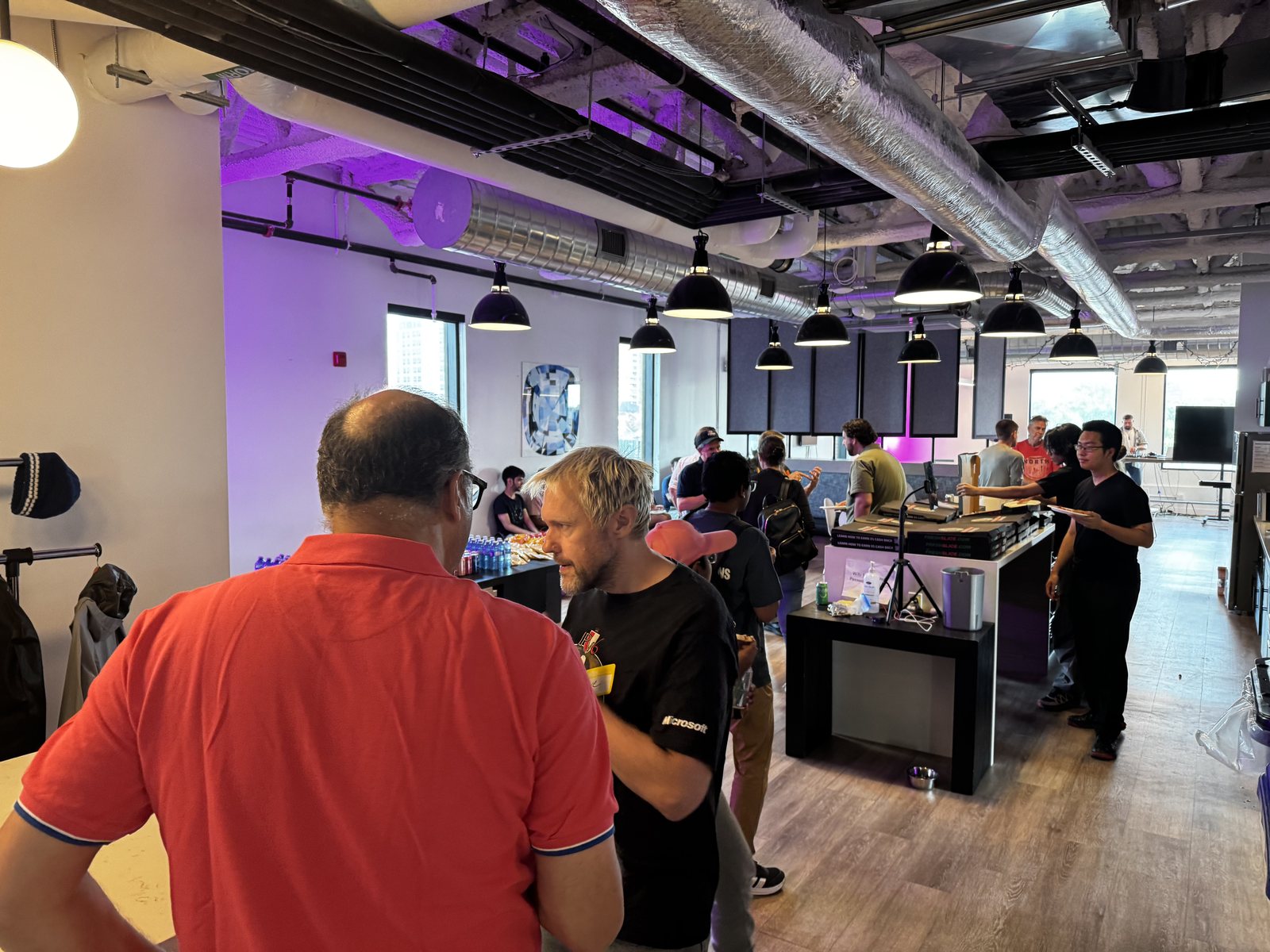Attendees gathering in the Builders Club space during devkick Kick 002